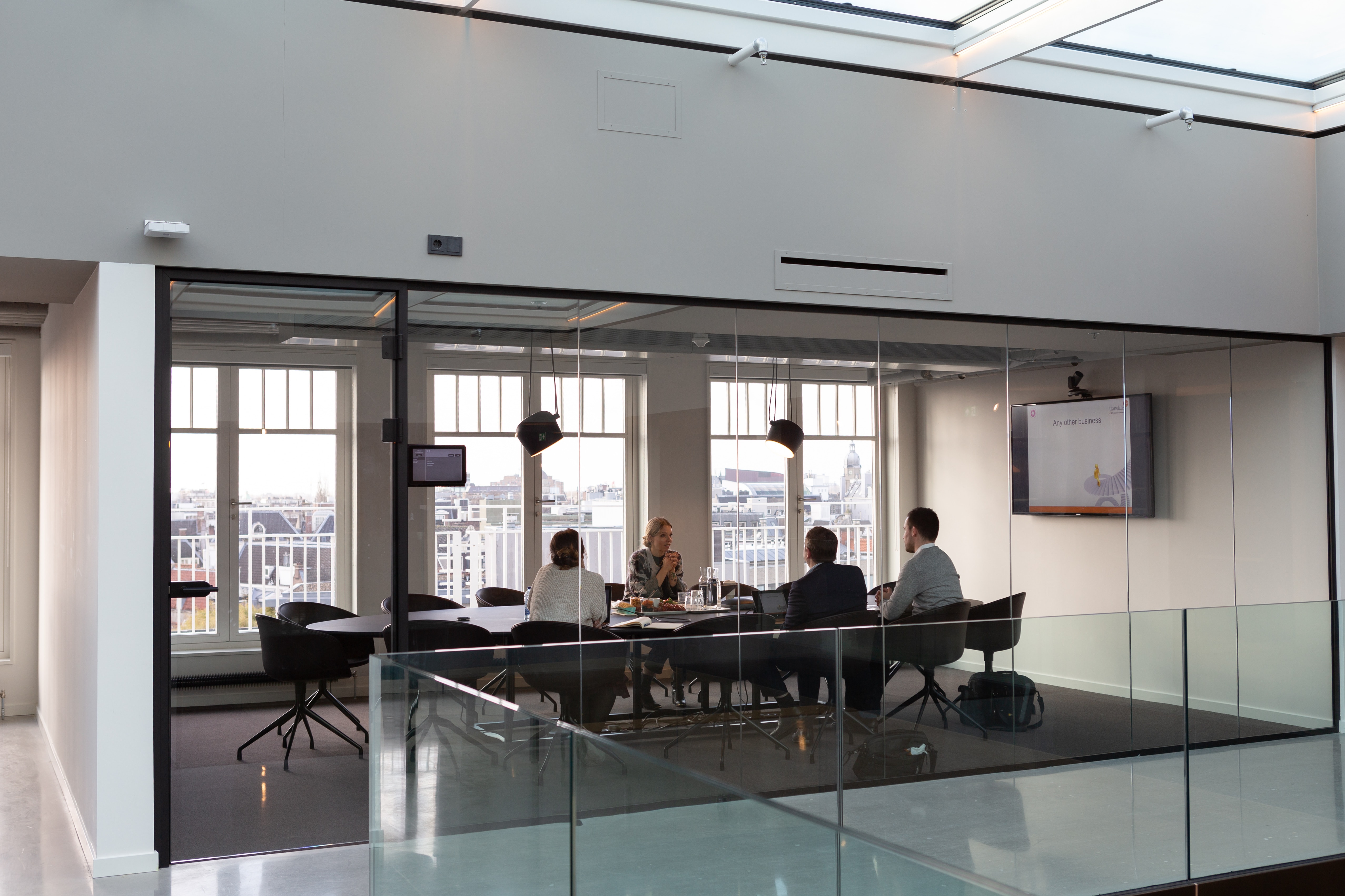 A picture of group of people taking part in a board meeting