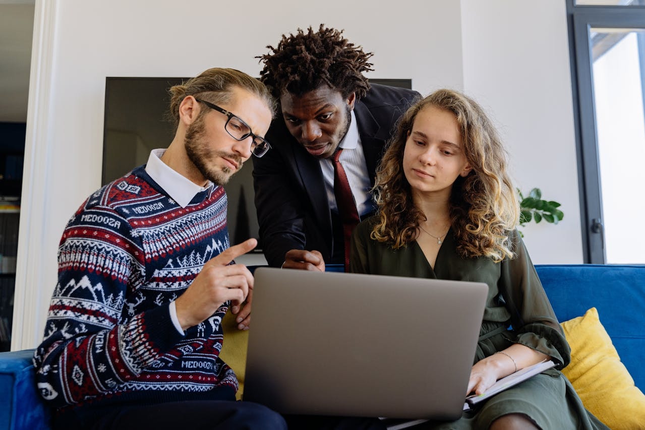 customer success manager meeting with two colleagues