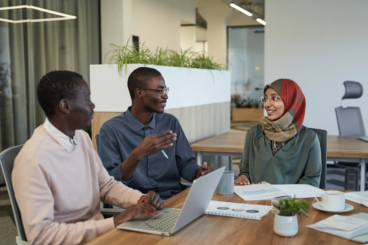 people having meeting taking meeting minutes