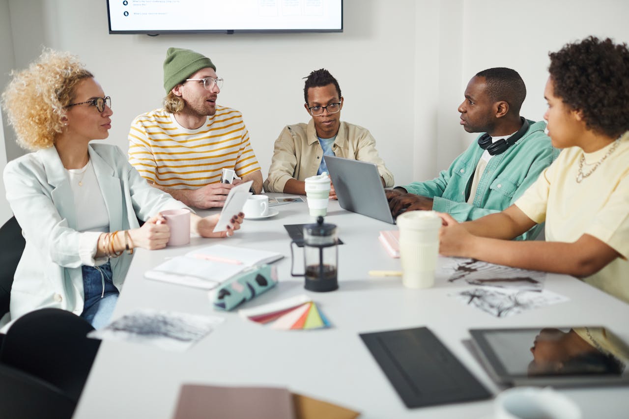 people having meeting taking meeting minutes