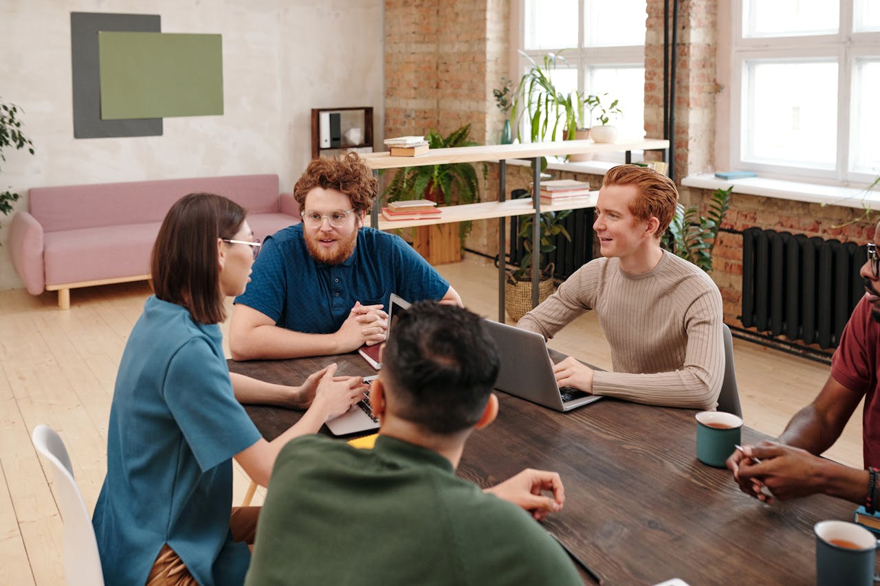 people having meeting taking meeting minutes
