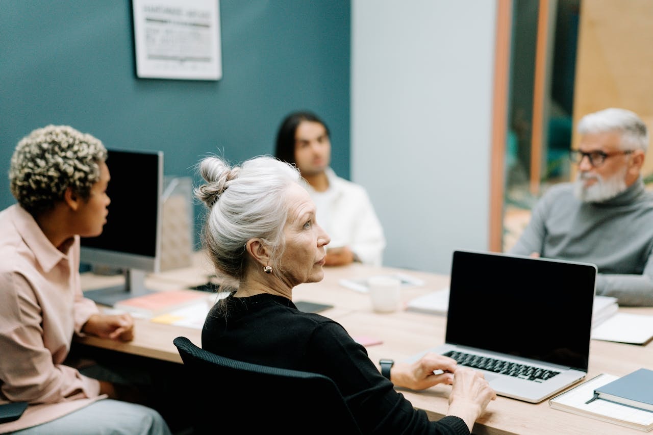 senior customer success manager in a team meeting